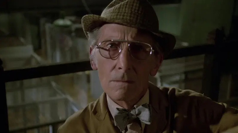 Martin Blueck (Peter Cushing) stares inquisitively in Hammer House of Horror