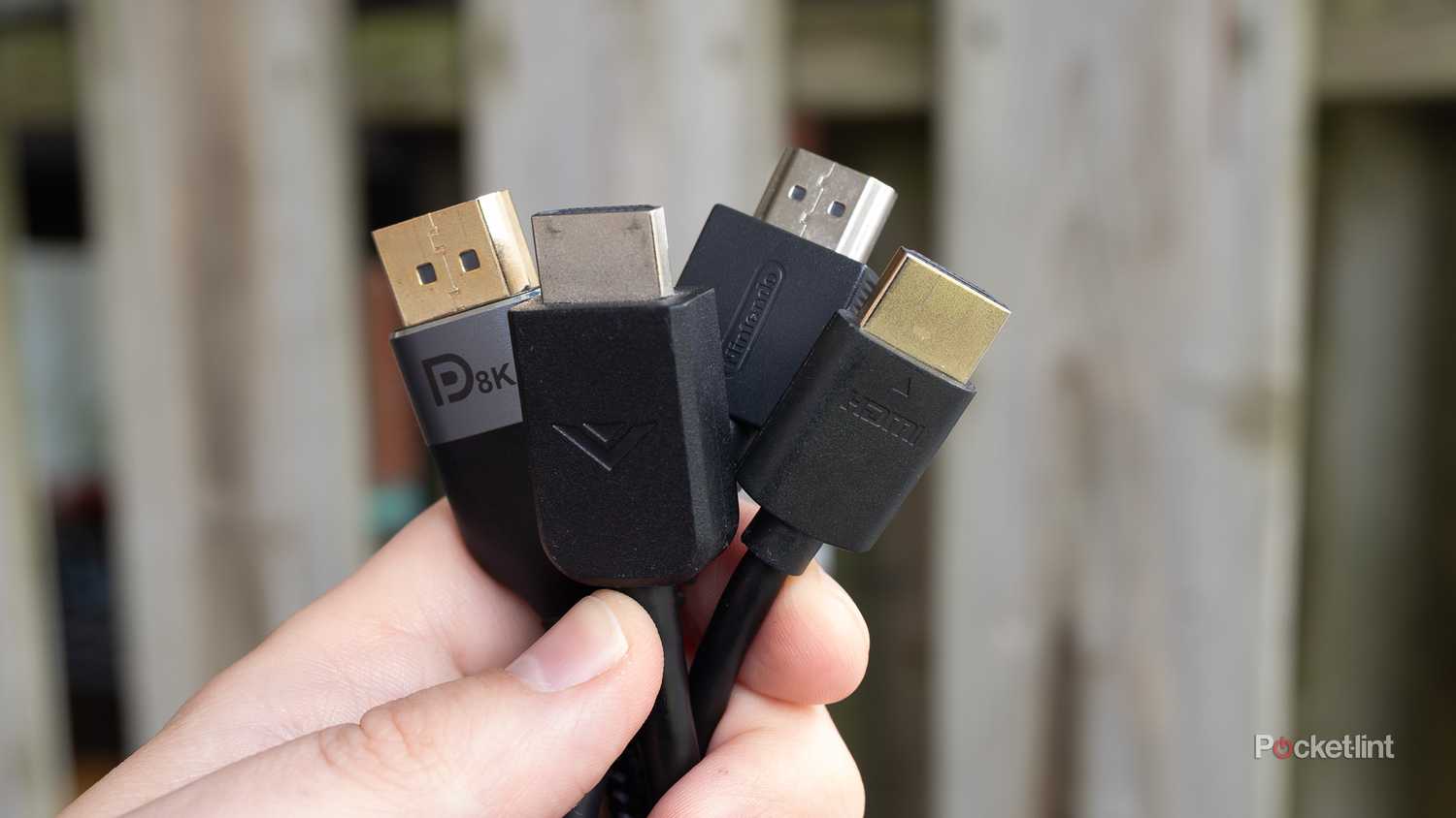 HDMI cables held in bundle.