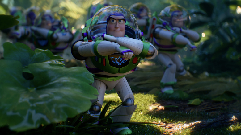 Hi-Tech Buzz Lightyears walk cautiously through a forest in Toy Story 5