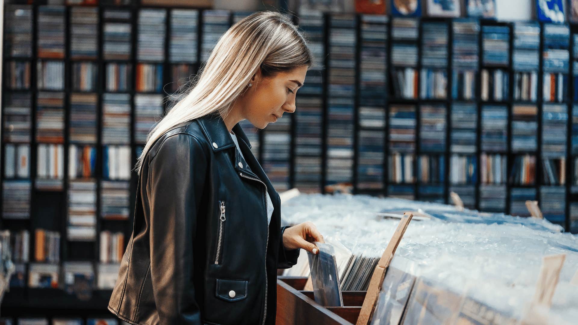woman at record shop searching for collectibles protecting her mental health
