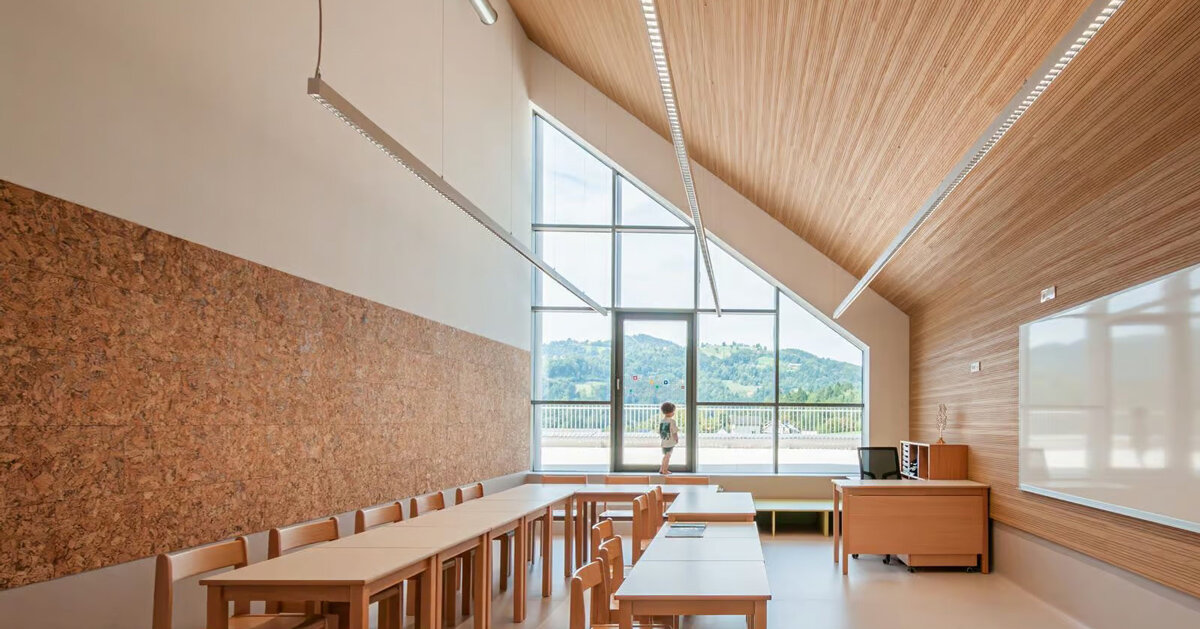 concrete and beech shape flexible learning spaces within school in slovenia