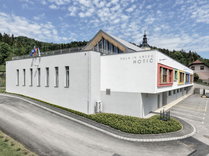 concrete and beech shape flexible learning spaces within school and social hub in slovenia - 2