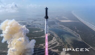 Falcon rocket launching straight up with pink exhaust plume over coastal wetlands, SpaceX logo bottom right.