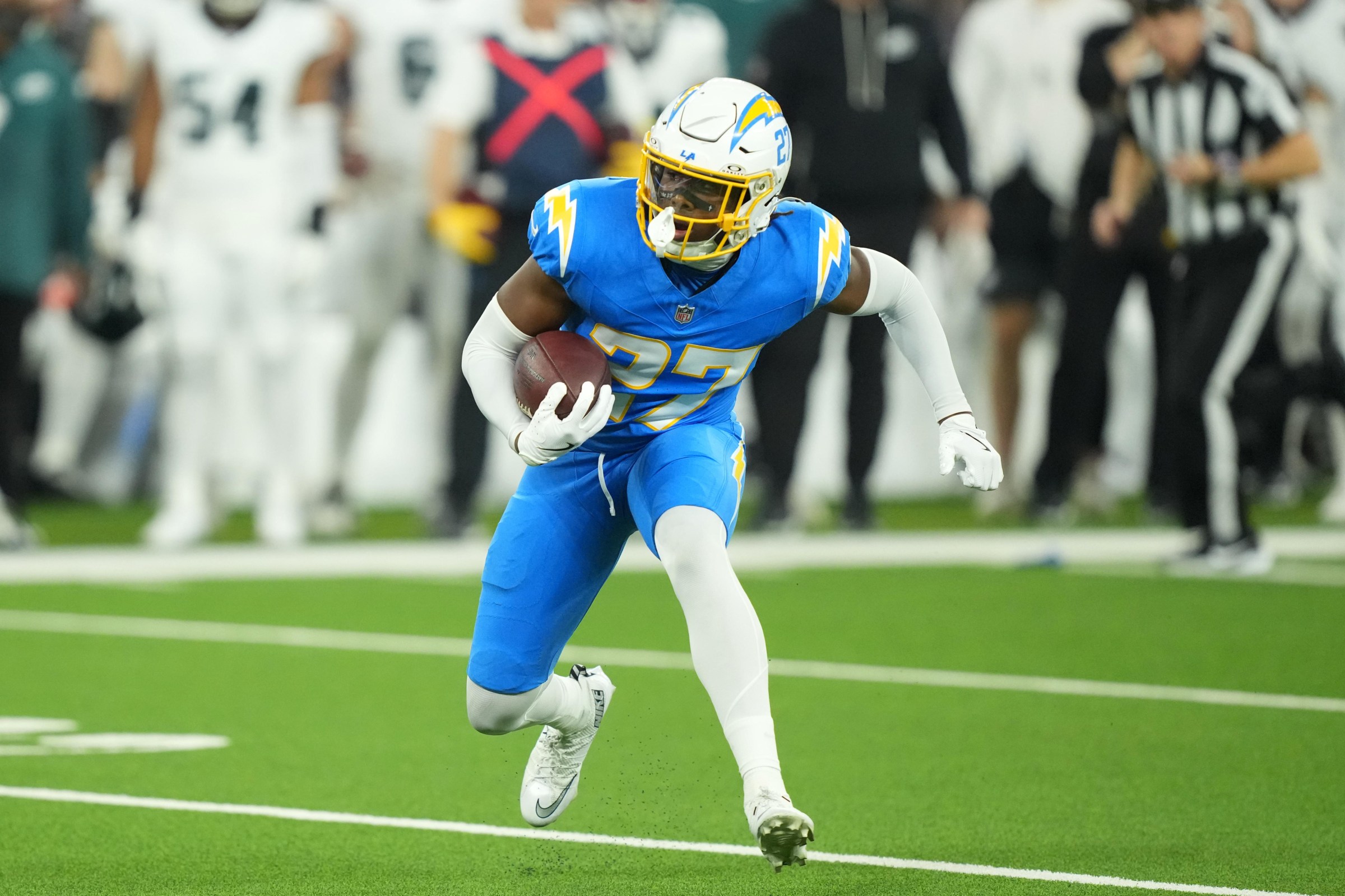 Dec 8, 2025; Inglewood, California, USA; Los Angeles Chargers safety RJ Mickens (27) runs against the Philadelphia Eagles in the first half at SoFi Stadium. Mandatory Credit: Kirby Lee-Imagn Images