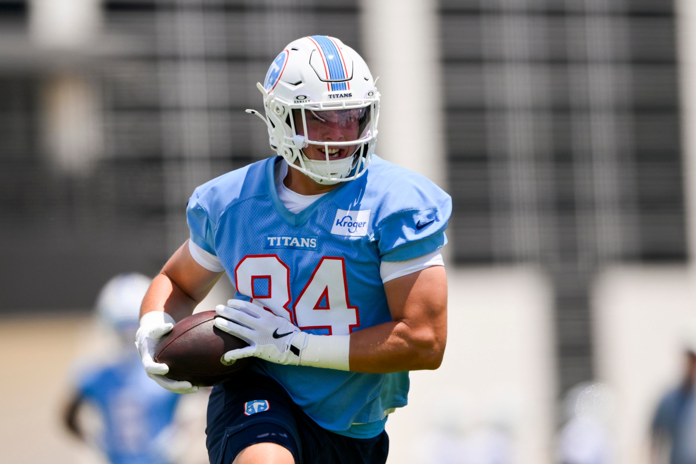 Jun 16, 2026; Nashville, TN, USA; Tennessee Titans tight end Gunnar Helm (84) runs with the ball after a made catch during day 1 of mini-camp at Vanderbilt Health Football Center. Mandatory Credit: Steve Roberts-Imagn Images