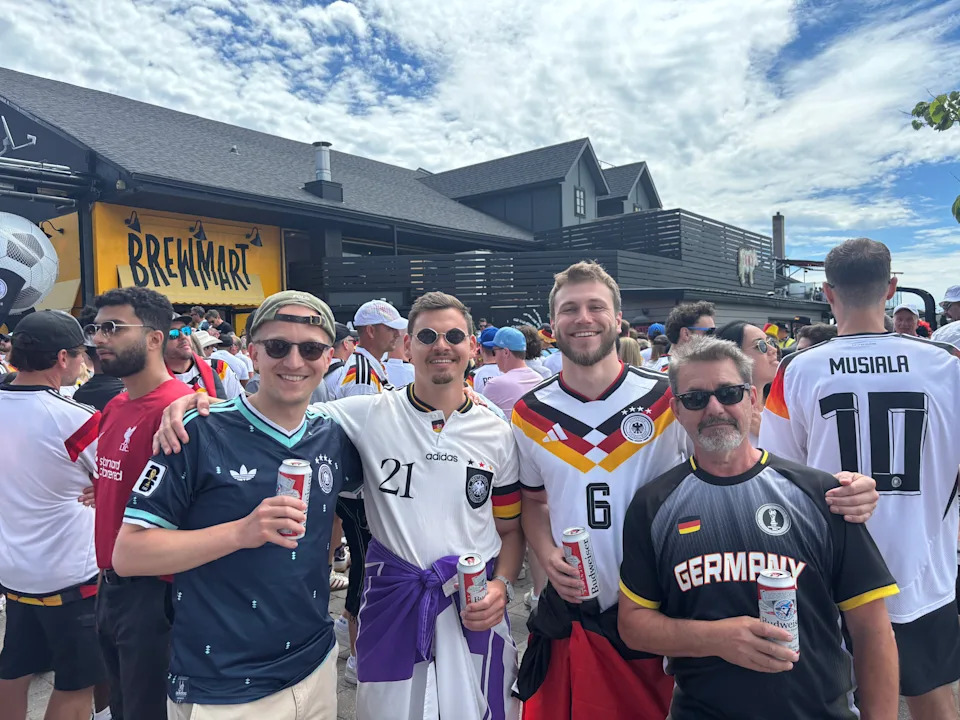 Group of four with beers at Amsterdam Brewhouse in Toronto