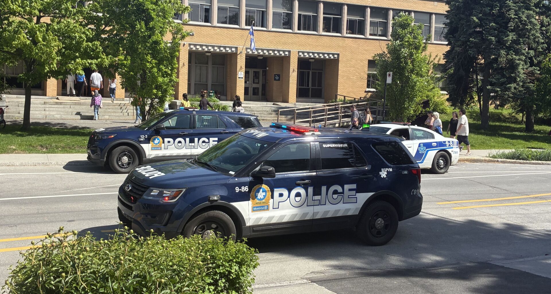 Police cars outside an elementary school.