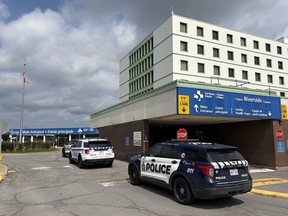 Police cars sit out front of the Ottawa Hospital.