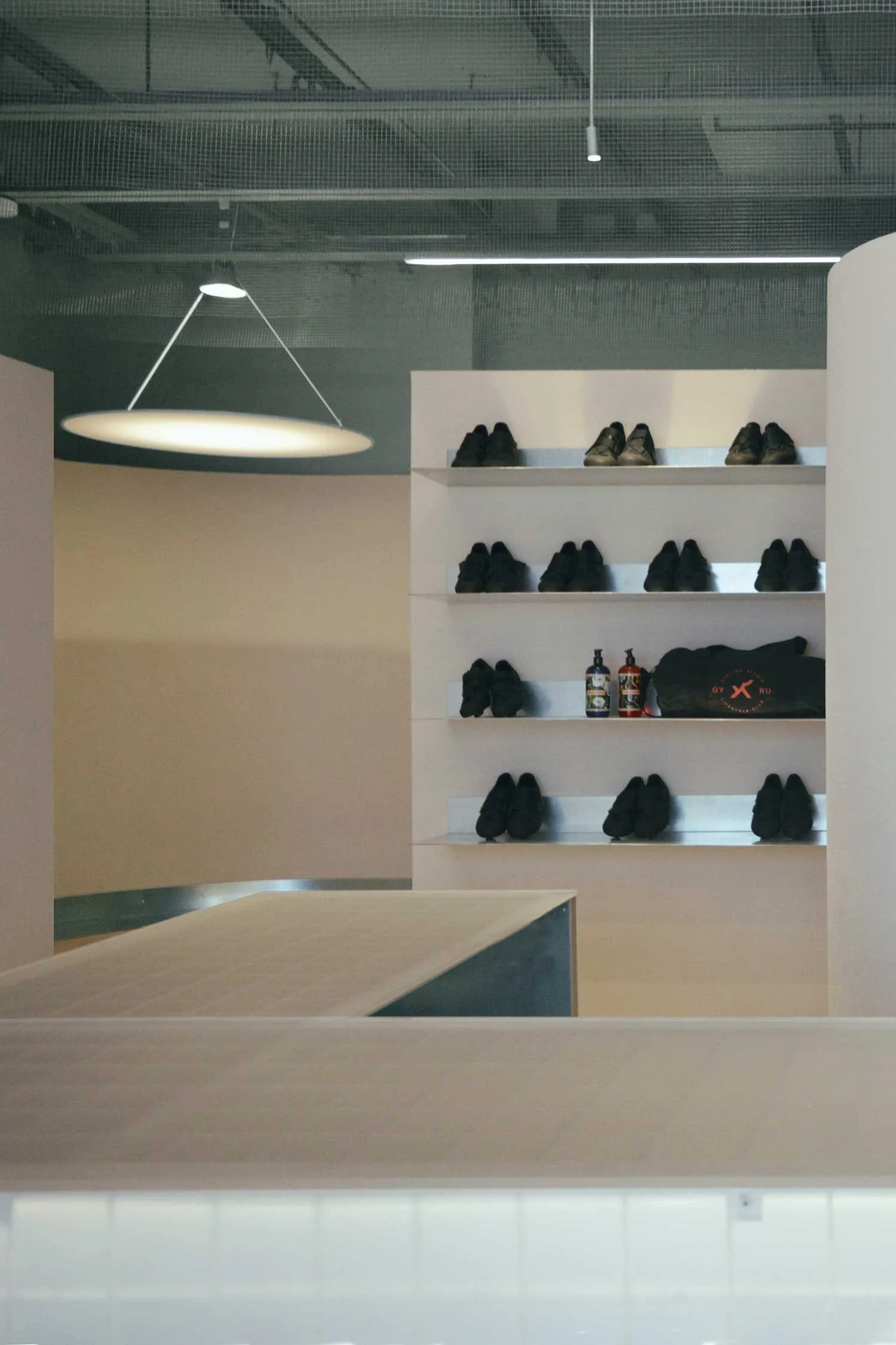 Shoe exchange station marks the transition into the cycling studio.