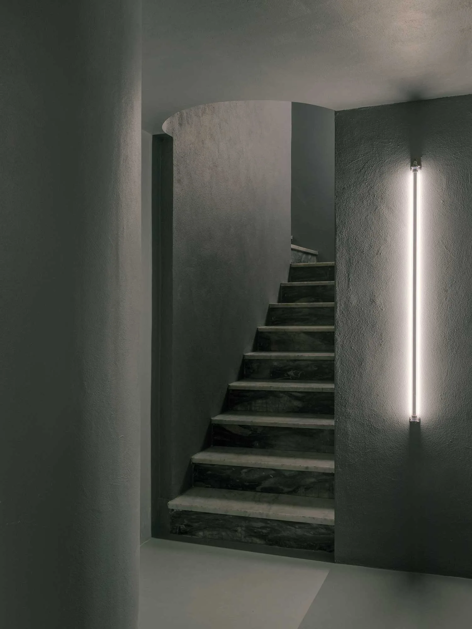 LED strip lights the way as cyclists descend into the studio.