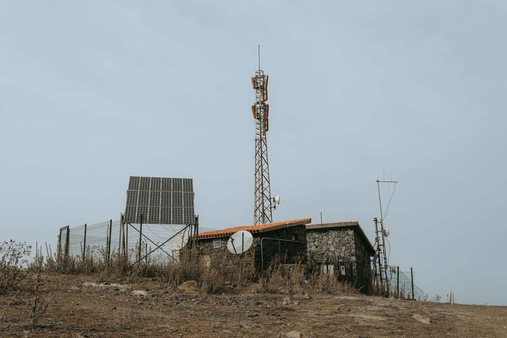 Rural remote station featuring solar panels and communication towers in the Canary Islands, Spain.