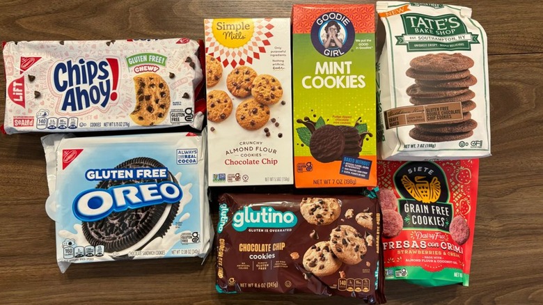 gluten-free cookie boxes on top of table, including packages from Tate's Bake Shop, Glutino, and Siete