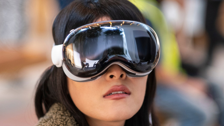 A woman wearing Apple's Vision Pro headset.