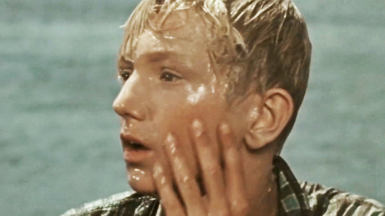 Josef Lukás' Petr holds his hand to his face in A Journey to the Beginning of Time
