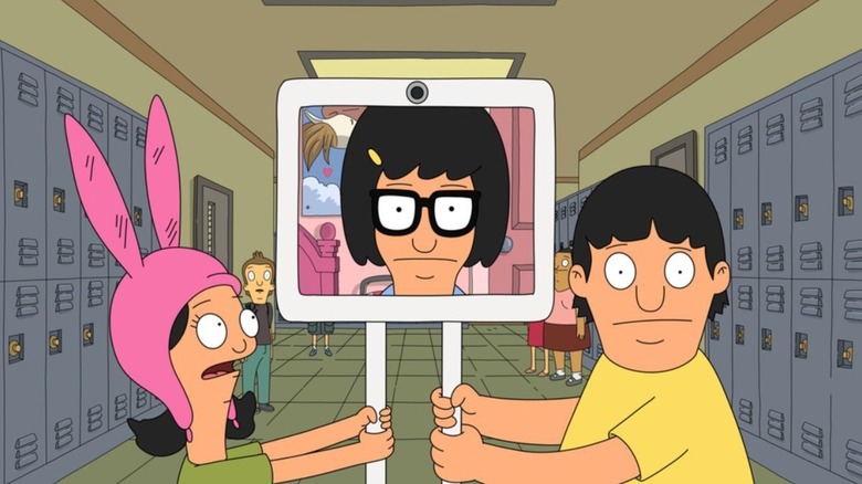 Louise and Gene carrying digital Tina down hallway