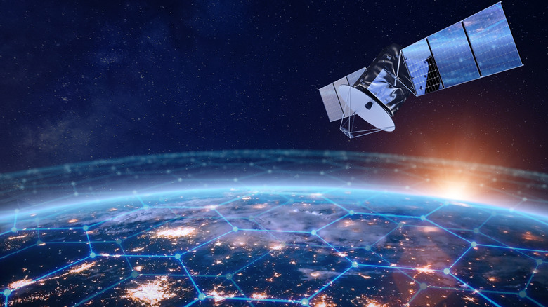 An illustration of a satellite orbiting Earth