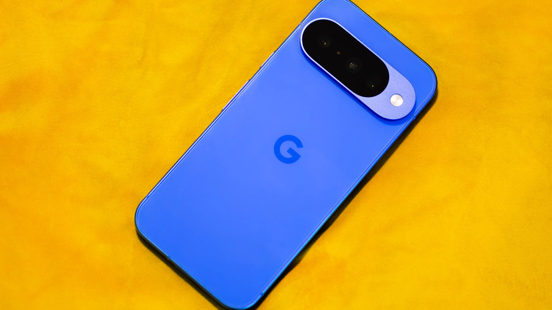 A blue Pixel 10 phone on a yellow background
