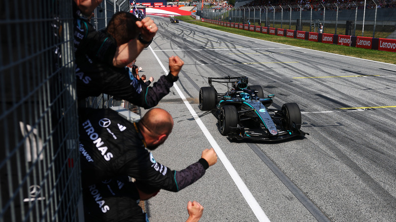 Race winner George Russell of Great Britain driving the (63) Mercedes AMG Petronas F1 Team W17 passes his team celebrating on the pitwall during the F1 Grand Prix of Austria at Red Bull Ring on June 28, 2026 in Spielberg, Austria.