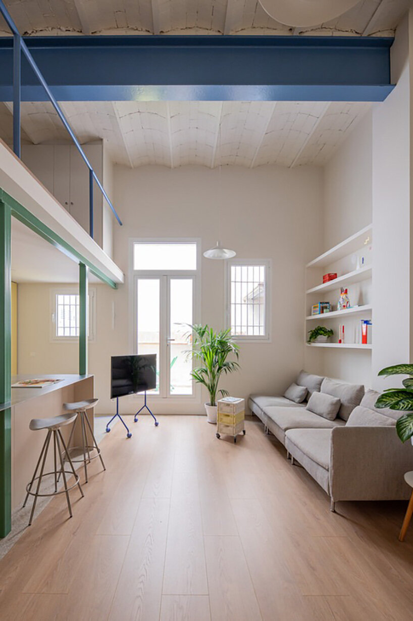 NOT A STUDIO uses color-coded structure to open up century-old barcelona apartment - 12