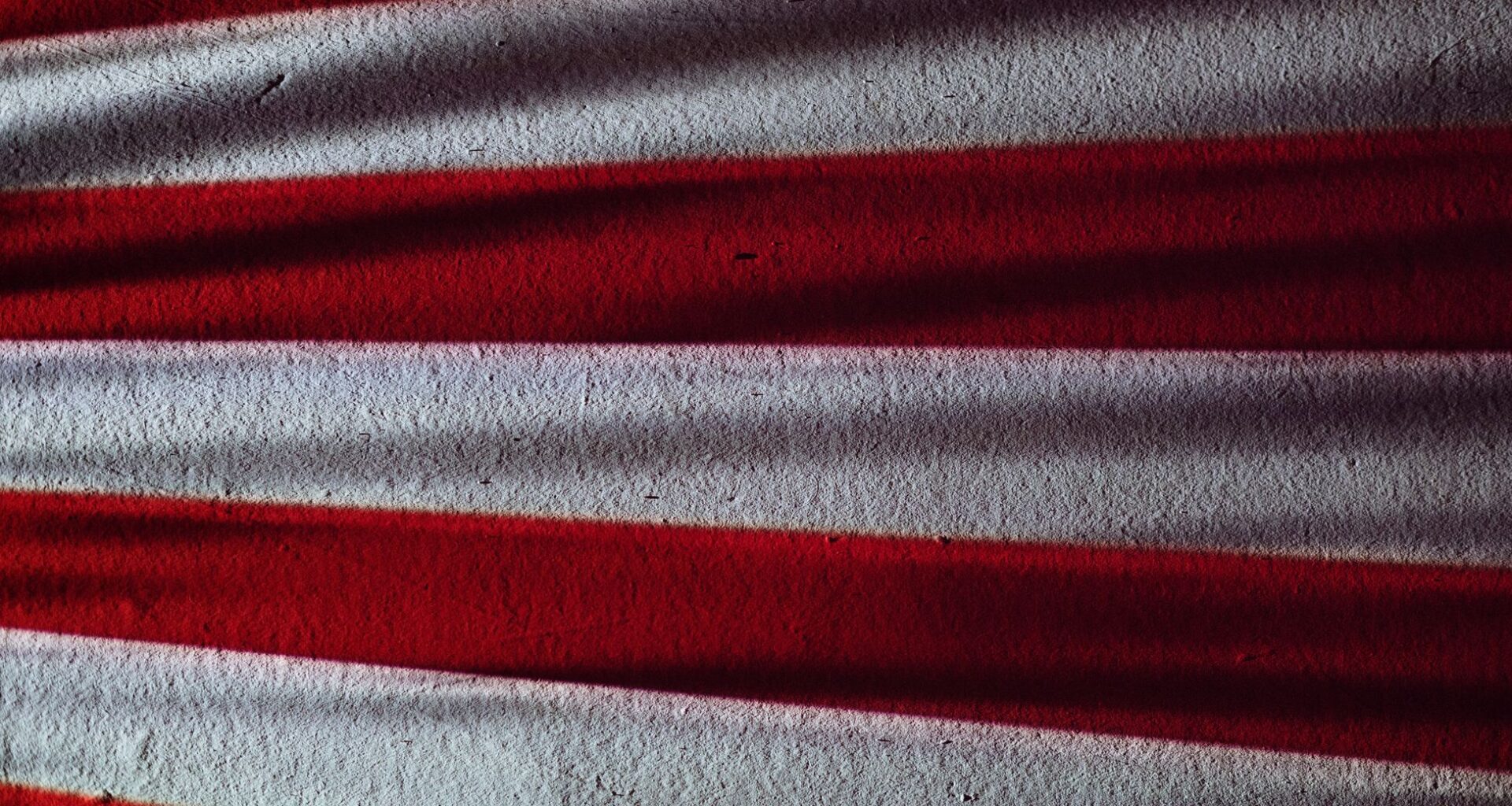 The American flags planted by Apollo astronauts have likely bleached pure white after 50 years of unfiltered solar radiation, leaving the most famous banners in history standing as blank cloth
