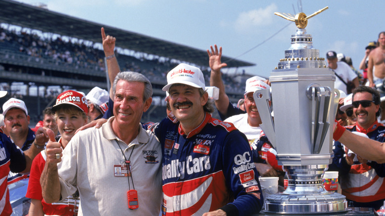 Dale Jarrett (R) and Ned Jarrett pose for a picture after Dale Jarrett won the Indianapolis 400 in Indianapolis, Indiana on August 3, 1996.