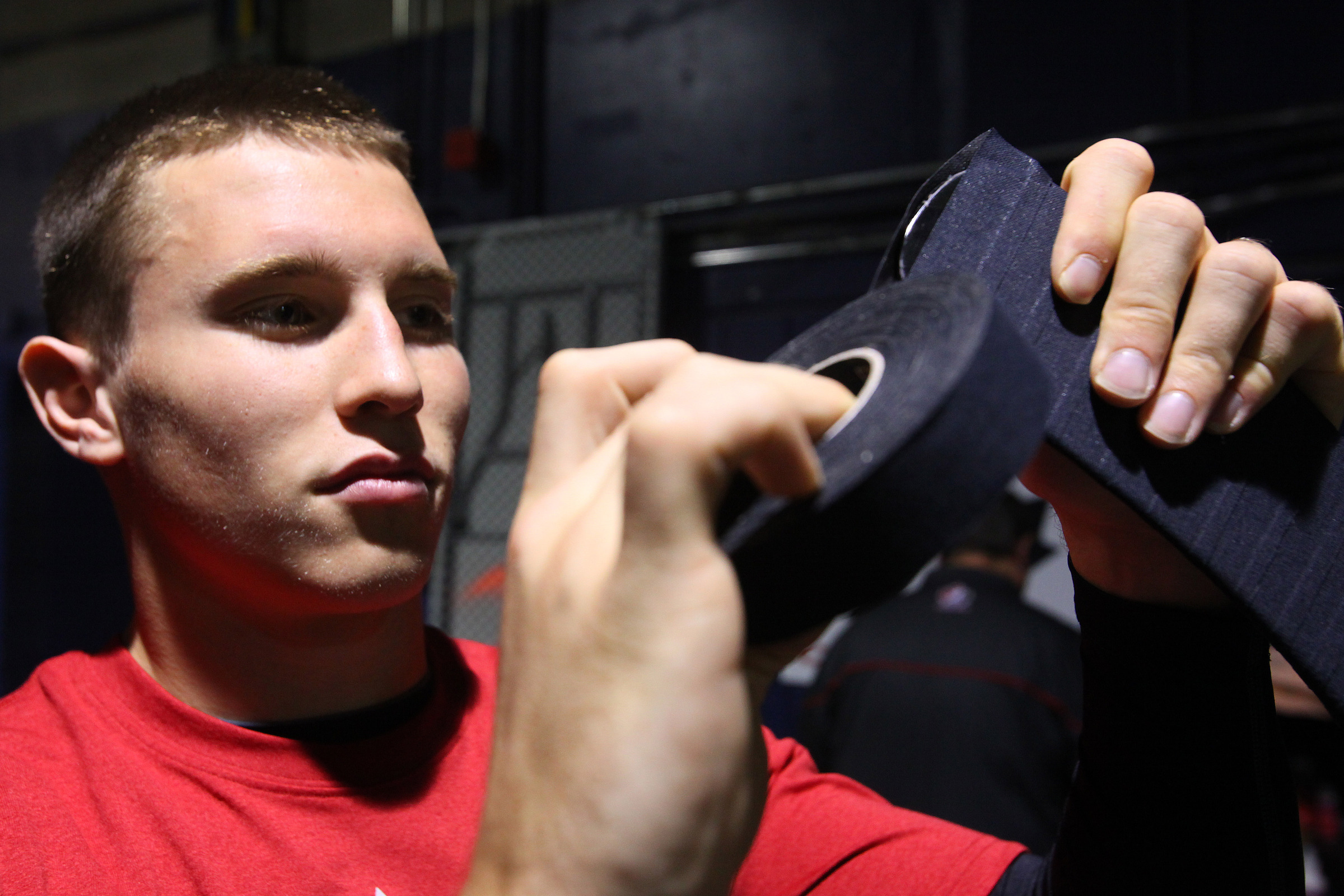 Brendan Gallagher applies tape to his hockey stick.