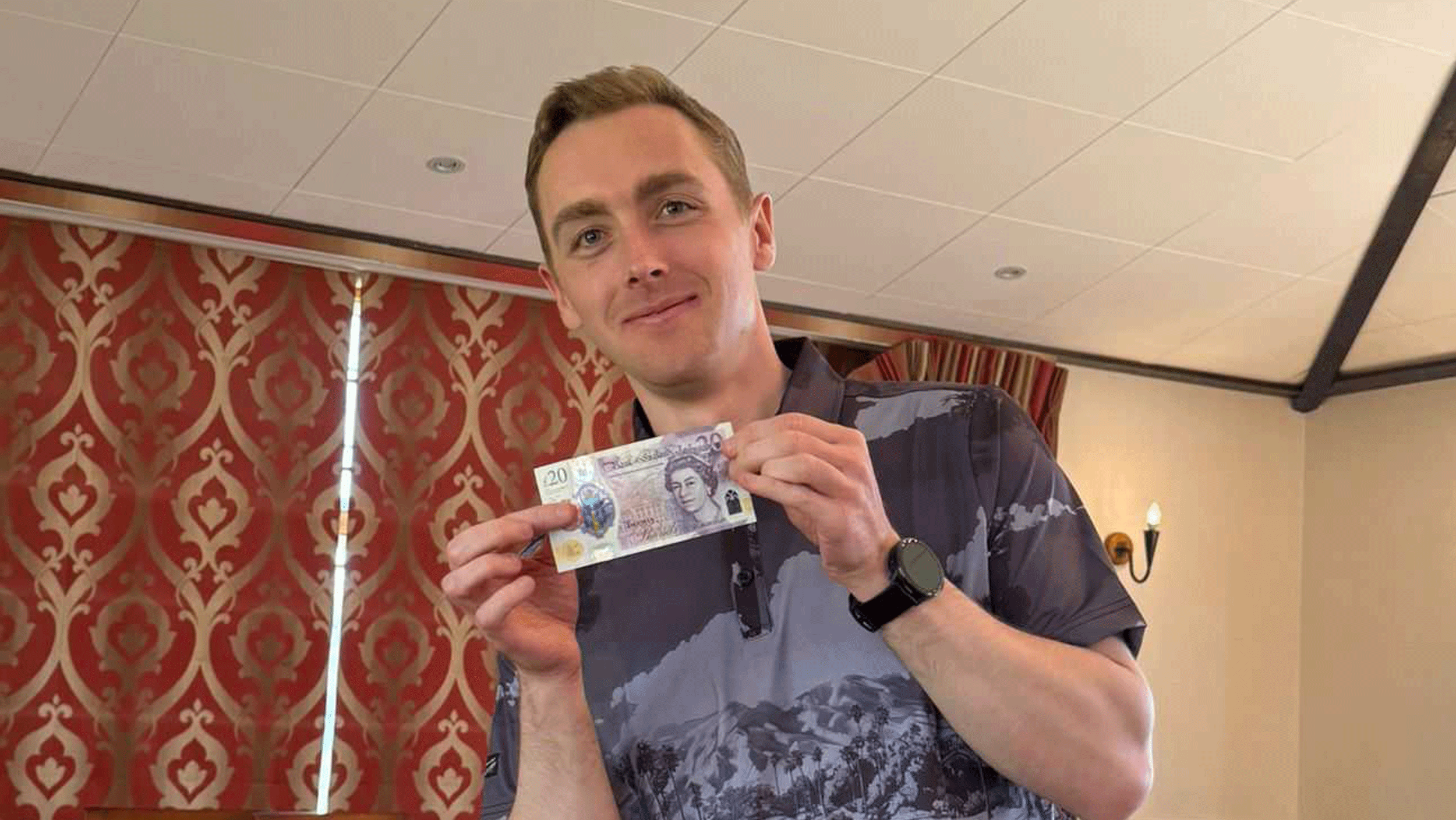 Jonny Leighfield poses with a &pound;20 note after winning both the individual and team prizes at Golf Monthly's Spring/Summer Test Day 2026
