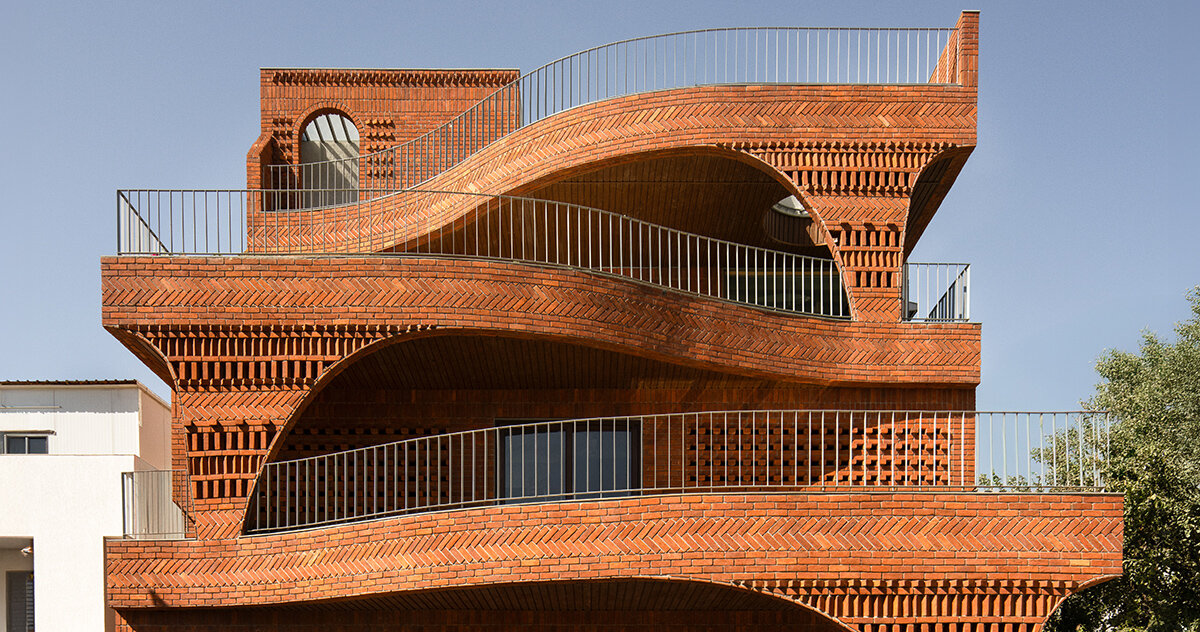 brick chambers and passages shape this 'anthill' house in india