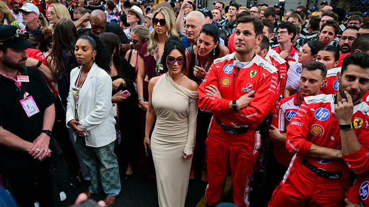 Kim Kardashian and Ferrari team members
