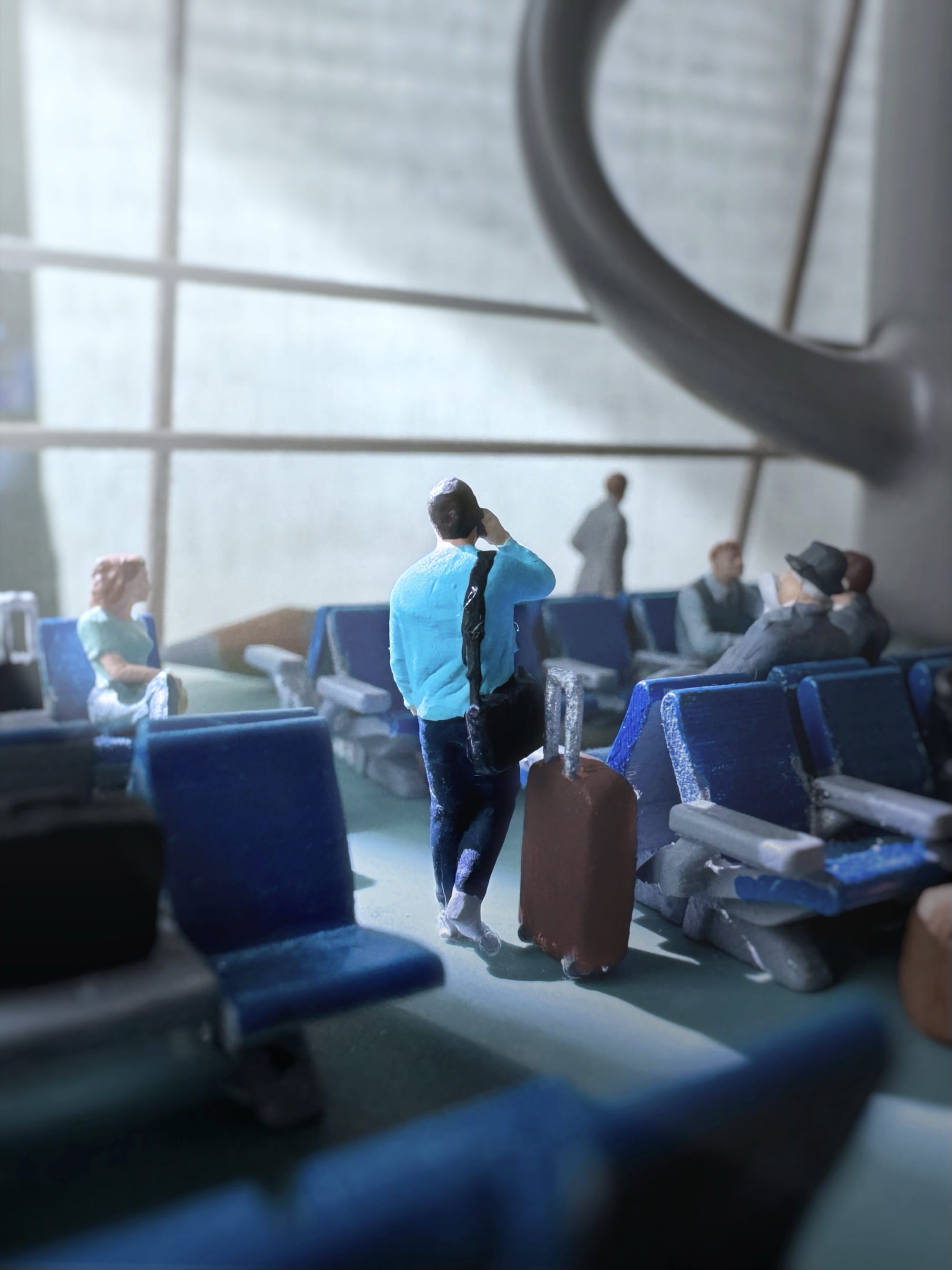 a photograph of a miniature tableau by Derrick Lin of a man on a phone in an airport, looking up at a giant coffee mug that appears part of the architecture