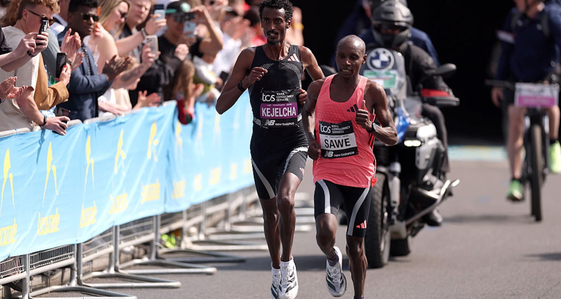 Sabastian Sawe of Team Kenya leads Yomif Kejelcha of Team Ethiopia during the Men's 2026 TCS London Marathon on April 26, 2026 in London, England.