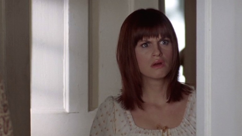 Amanda staring in shock from under a door frame on Lost in Austen S1E2