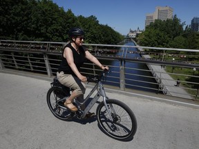 Lynn Saxberg rides an e-bike
