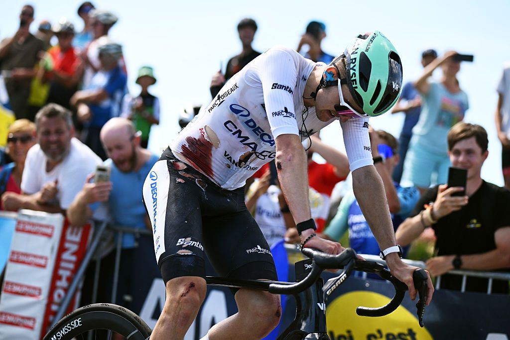 GRAND COLOMBIER, FRANCE - JUNE 13: (EDITOR&rsquo;S NOTE: Image contains graphic content.) Paul Seixas of France and Team Decathlon CMA CGM - White Best Young Rider Jersey crosses the finish line injured after being involved in a crash during the 78th Tour Auvergne-Rhone-Alpes 2026, Stage 7 a 133.6km stage from La Bridoire to Grand Colombier 1496m / #UCIWT / on June 13, 2026 in Grand Colombier, France. (Photo by Dario Belingheri/Getty Images)