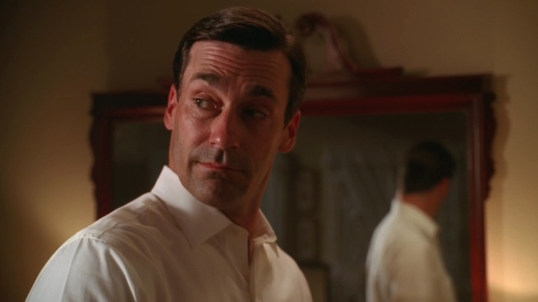 Don standing next to a mirror on Mad Men S3E8