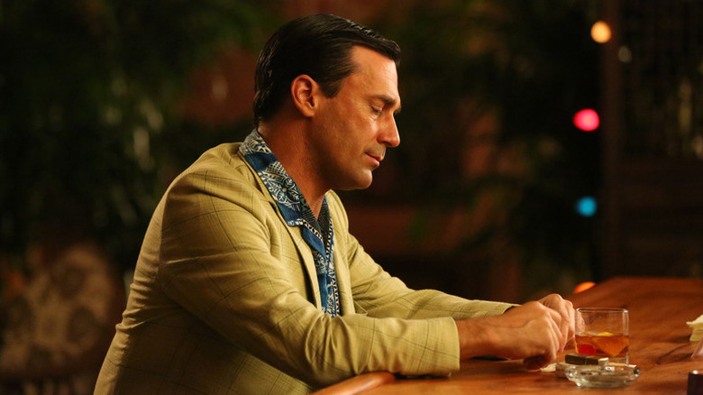 Don Draper (Jon Hamm) sits alone at a bar in Mad Men