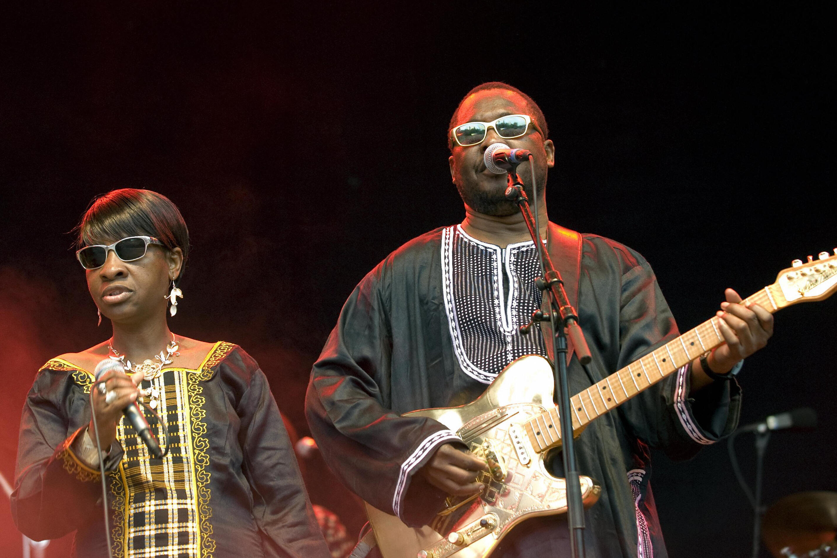 Man and woman perform on stage.