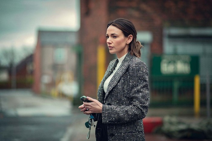 michelle-keegan-harlan-coben Michelle Keegan stars in Harlan Coben's Fool Me Once wearing a grey jacket, holding a phone