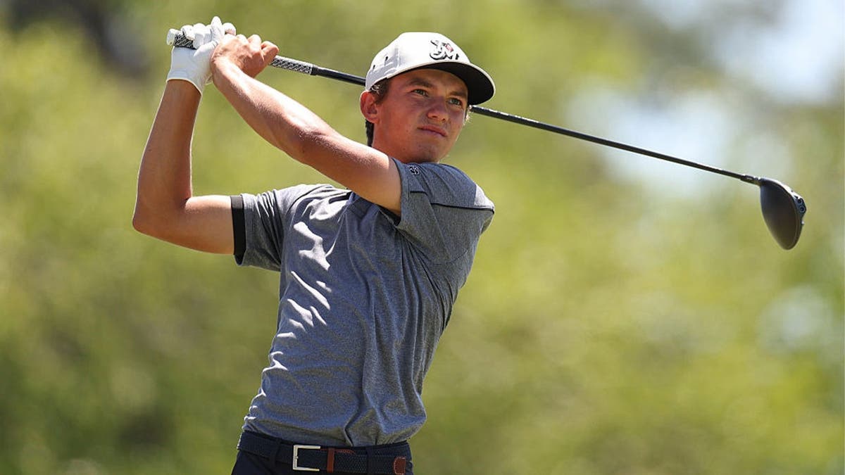 Miles Russell plays his tee shot