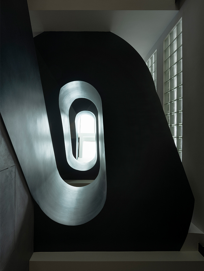 sculptural steel spiral staircase reorganizes circulation in a century-old shanghai house - 3