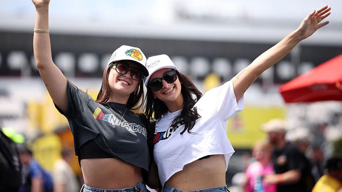 NASCAR fans posing for photos at Pocono Raceway in Long Pond, Pennsylvania