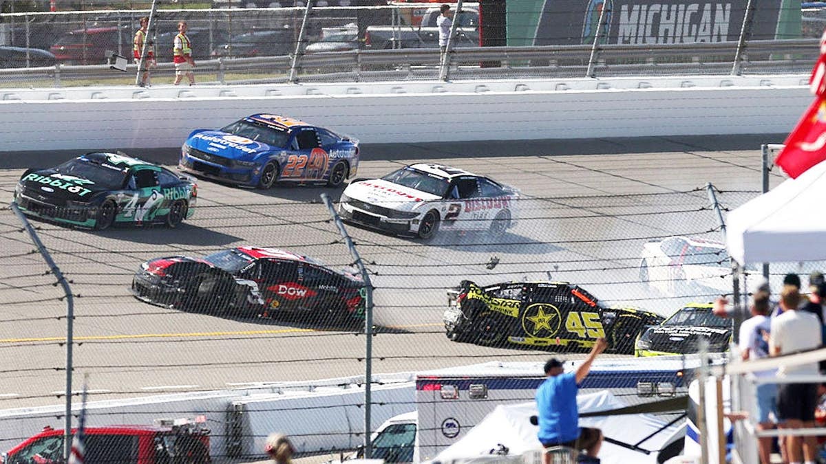 Austin Dillon, Tyler Reddick, and Denny Hamlin spin their cars on track at Michigan International Speedway