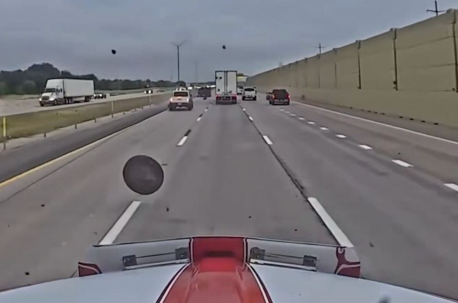 NASCAR hauler hits flying wheel in wild traffic incident caught on camera