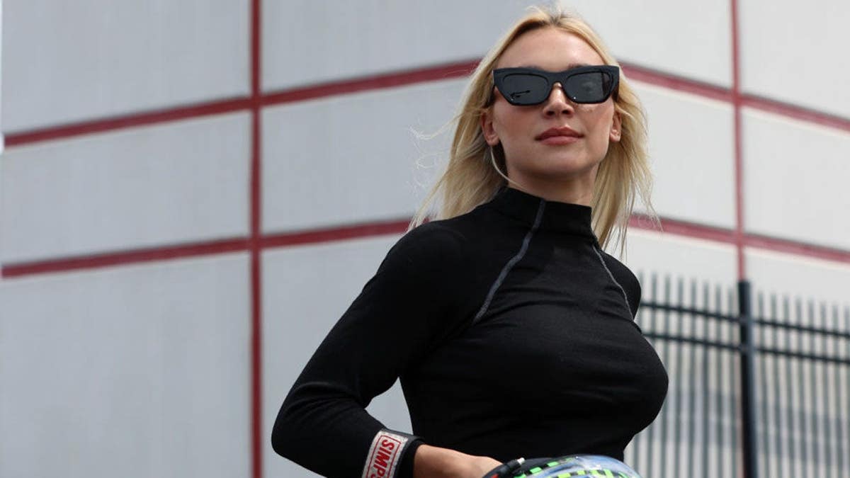 Natalie Decker walking the grid at Charlotte Motor Speedway during NASCAR Xfinity Series practice