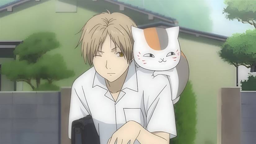 Natsume and his cat friend spend time together in Natsume’s Book of Friends