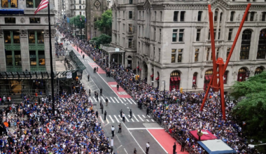 Crowds fill the sidewalks waiting for the start of the NBA Champion New York Knicks taker-tape parade on Broadway, in New York's Canyon of Heroes, Thursday, June 18, 2026.