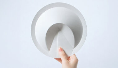 a ribless circular folded sculpture reimagines the traditional japanese paper fan