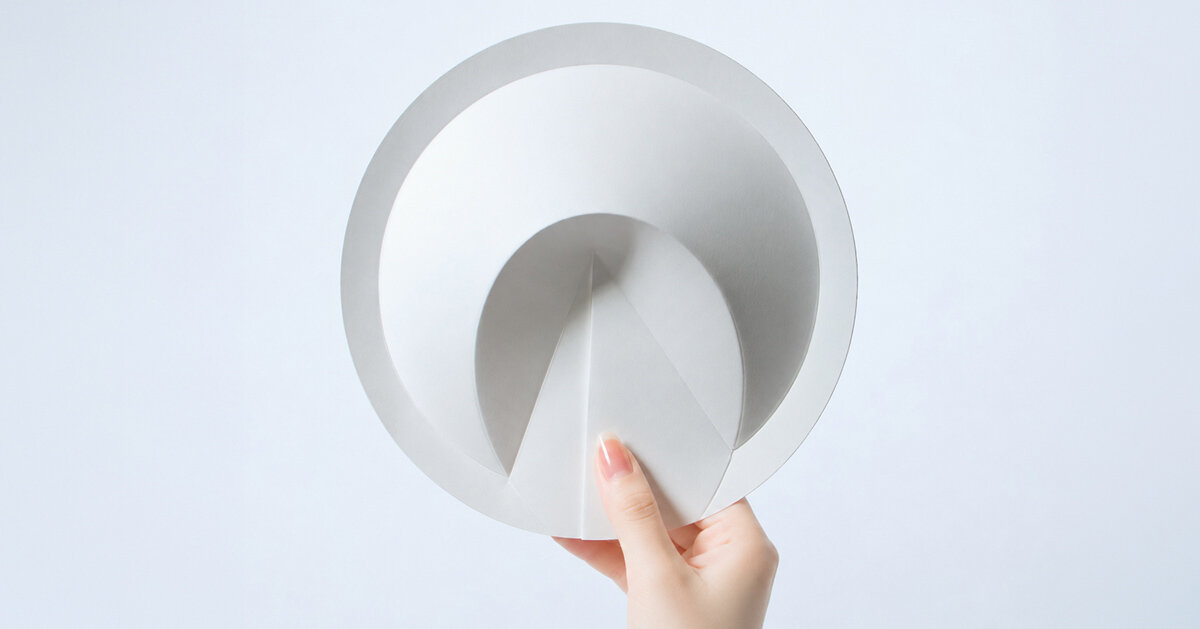 a ribless circular folded sculpture reimagines the traditional japanese paper fan