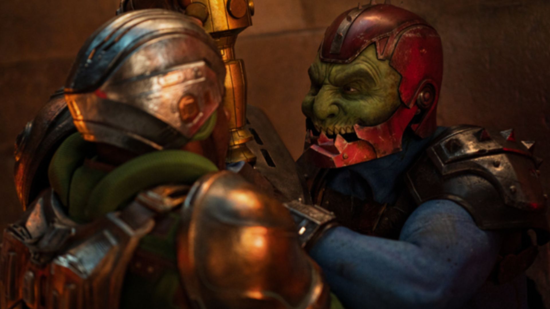 Green faced alien fights man in battle suit.