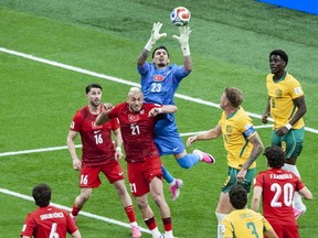 Turkey goaltender Ugurcan Cakir grabs a corner kick in the first half of play.